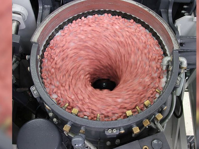 Ceramic finishing media in a vibratory bowl